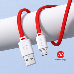 Red and white braided USB-A to Micro-USB charging cable with anti-tangle design, shown coiled around a white cylindrical prop against a light blue background.